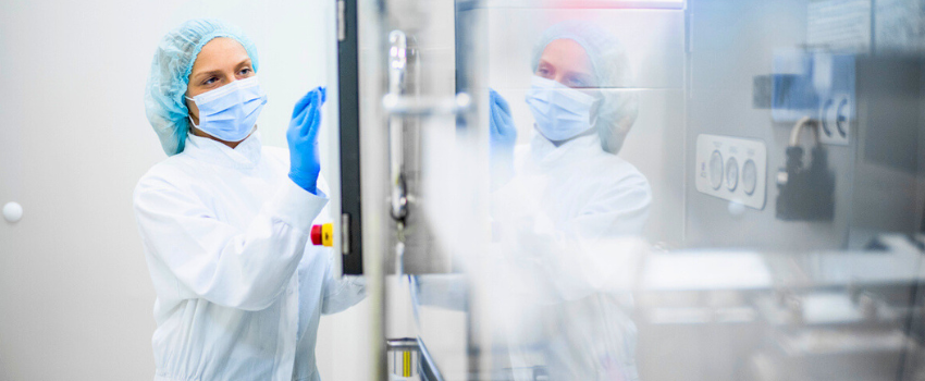 Pharmaceutical Worker Examining Pill