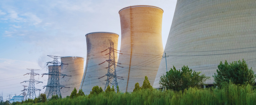 Coal fired power station with cooling towers releasing steam