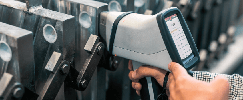 The inspector is material analysis (pmi and xrf) is measuring in stainless steel (ASTM A 304 material) with digital portable material analyzer.